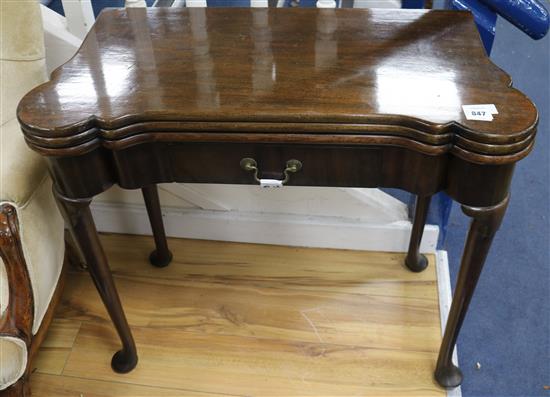 An early 18th century style mahogany triple flap card table, W.83cm